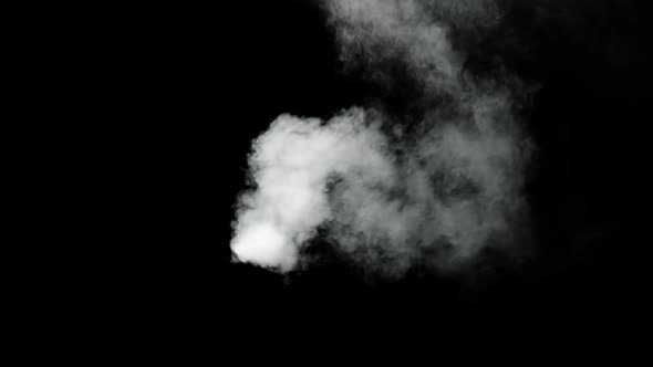 Billowing smoke blown around the frame. Shot on black for easy compositing. alt