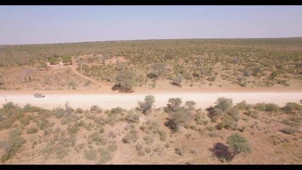 Expedition Pickup Traveling on Dirt Road