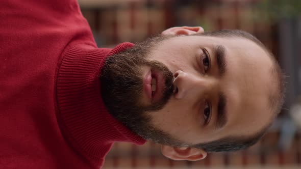 Vertical Video POV of Businessman Attending Videocall Meeting in Office alt