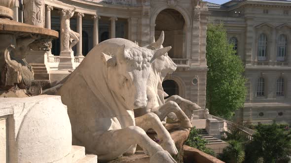 Bull statues on a building facade alt