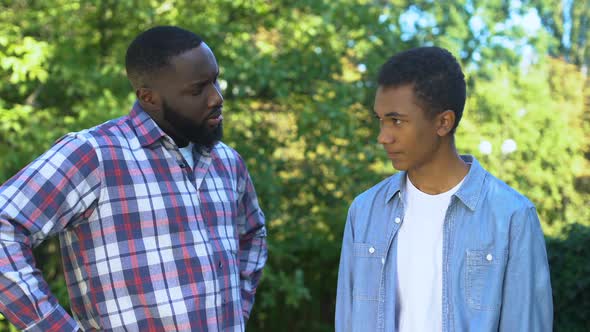 Kind Father Hugging Teenage Son Admitting Guilt, Child Upbringing, Parenting alt