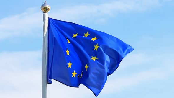 Flag of European Union Waving on the  Blue Sky