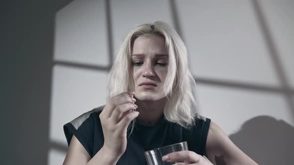 Unhappy Young Woman Addict Wants To Eat Pills