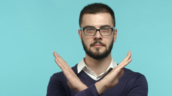 Close Up of Brunette Male Manager in Glasses Showing Cross Stop Gesture Shaking Head and Saying No