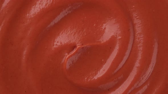 mix ketchup and mayonnaise sauce top view, rotation. Most popular food sauces. 4K UHD video alt