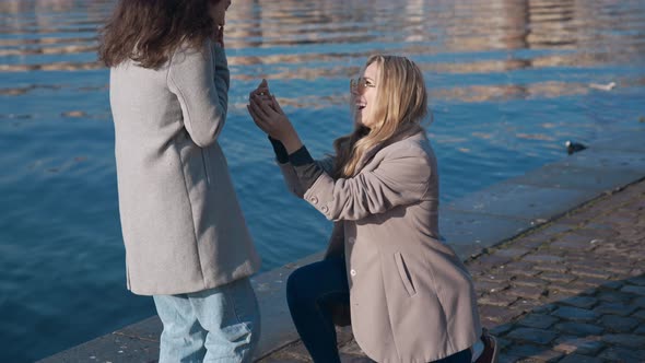 Pretty Lesbian Girl Proposing to Her Girlfriend to Get Married alt