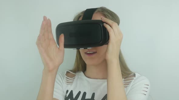Young Sexy Woman Uses A Modern Virtual Reality Helmet