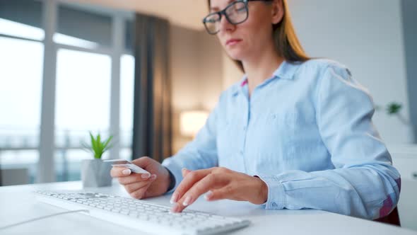 Woman Typing Credit Card Number on Computer Keyboard. She Making Online Purchase. Online Payment alt