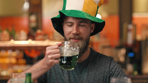 Portrait of man celebrating Saint Patrick's Day at the bar alt