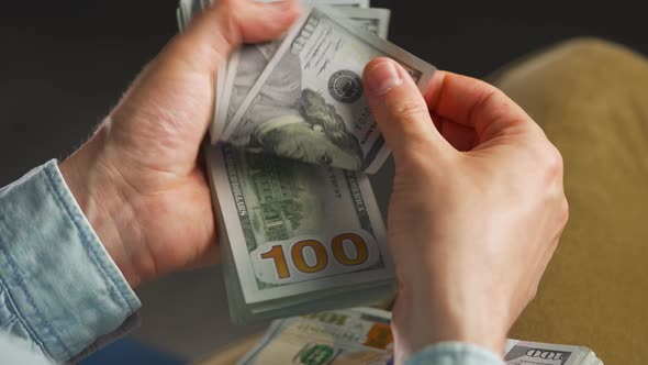 Hands Counting US Dollar Bills or Paying in Cash alt
