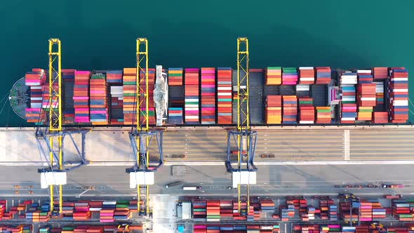 Aerial view from drone of Container , container ship in export and import business and logistics. alt