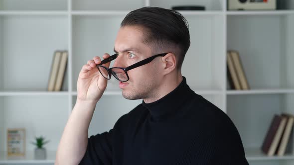 Portrait of Shocked Male Businessman in Takes Off Glasses and Say What alt