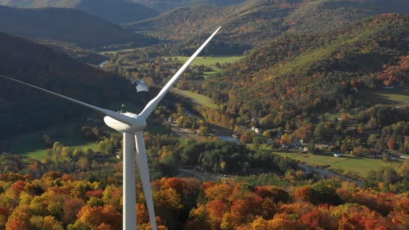Windmill turbine wind farm aerial during beautiful autumn leaf season alt