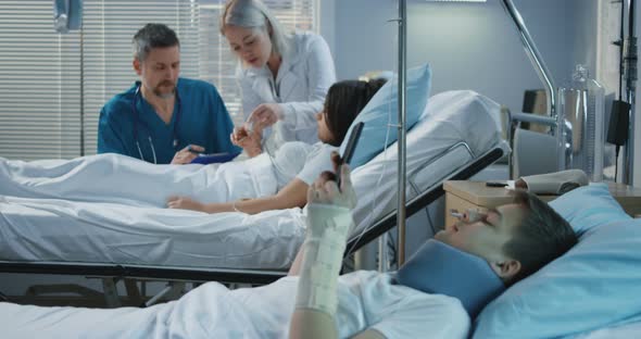 Patients and Doctors in Hospital Room alt