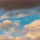 Golden Clouds and Dark Thunderclouds Floating Across Sunny Blue Sky. Time Lapse - VideoHive Item for Sale