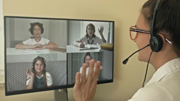 Teacher Leads a Video Lesson for Four Students. Features of Distance Learning. Back To School.