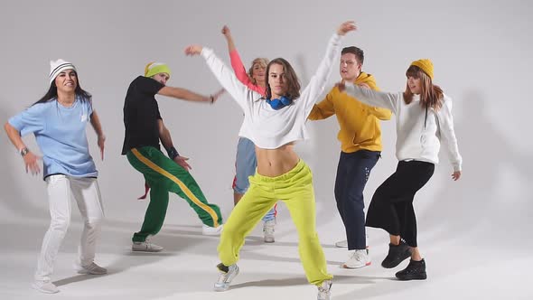 Young Pretty Group of Professional Dancers Exercising Modern Dance Movies. alt