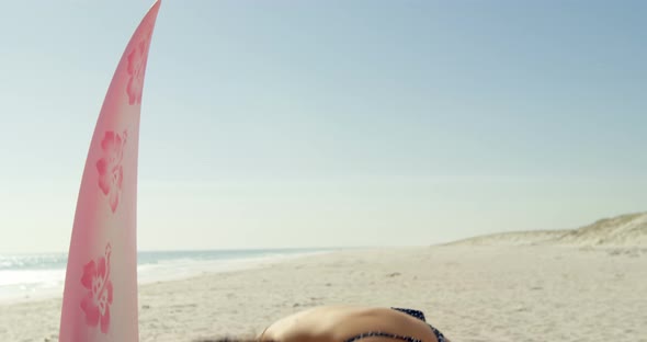 Female Surfer Flipping Her Hair on The Beach alt