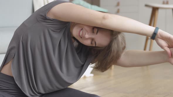 Young Woman Doing her Daily Stretch Routine alt