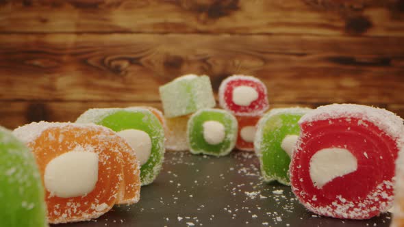 Colorful Turkish Delight Sweets on Wooden Background Zoom in Video