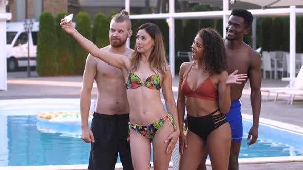 Multiracial Friends Posing for Selfie Near Pool alt