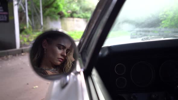 Face of Suffering and Sleeping Woman in Mirror of Auto, Dramatic and Tragedy alt