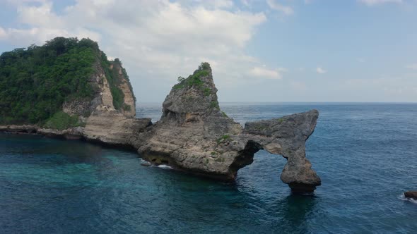 Aerial View of Tropical Island Washed By Ocean Atuh Beach alt