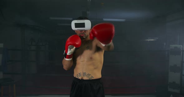 Young Man Boxing With Virtual Reality Headset