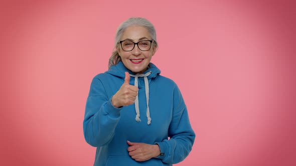 Senior Old Granny Woman Raises Thumbs Up Agrees with Something or Gives Positive Reply Likes Good alt