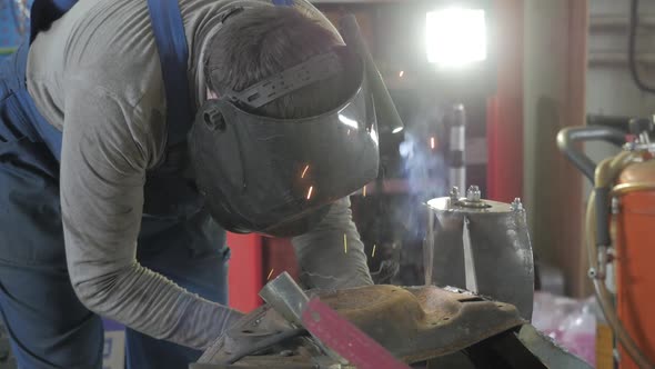 Welding Process. Workman Works, Worker Works In The Auto Workshop