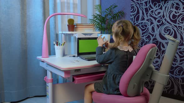 Online Learning Distance Education Lesson at Home Technology for Kids Laptop with Green Screen alt