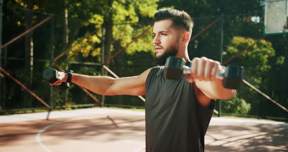 Fit Man Working Out with Dumbbells alt