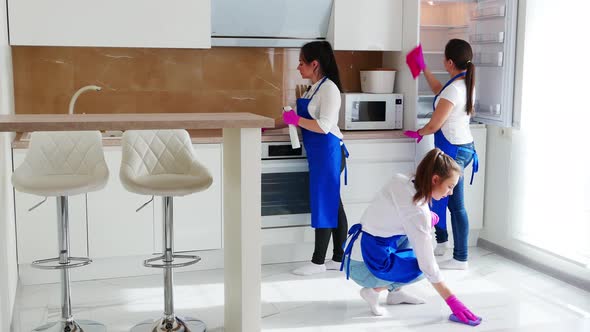 Careful Cleaning of Kitchen Cabinets. Wipe the Stain in Gloves for Cleaning