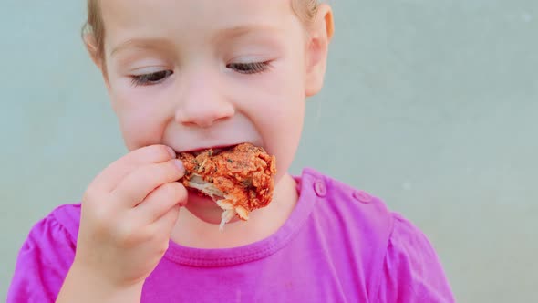Close Up Portrait of a Pretty Little Girl Eating Fried Chicken Hungry Kid Meat