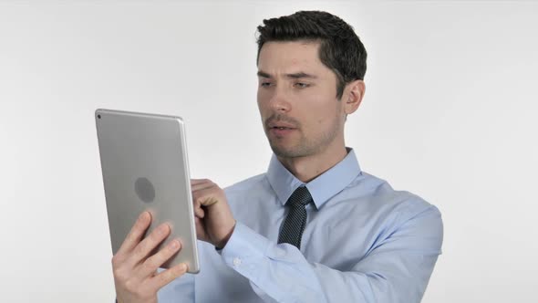 Businessman Browsing Internet on Tablet alt