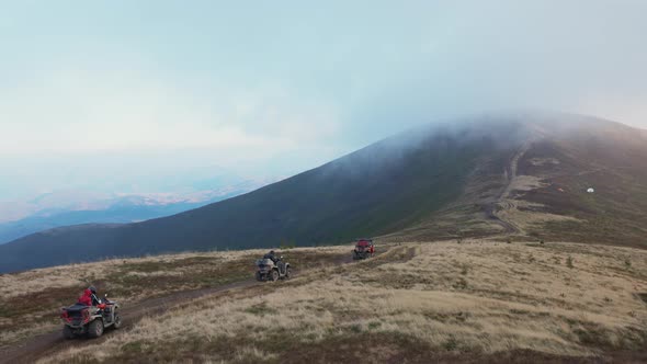 Quad Biking on a Mountain Road in Bad Weather alt