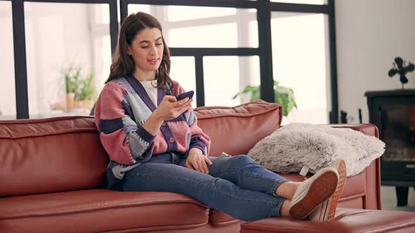 Caucasian Woman Using Mobile at Home