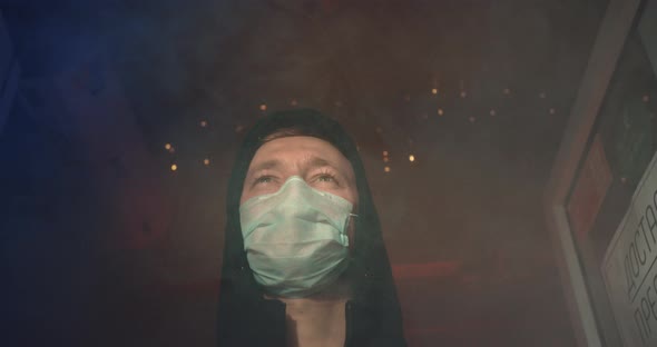 Masked Man Stand in Danger Smoke Disinfect After Fire. Corona Virus Covid-19 . alt