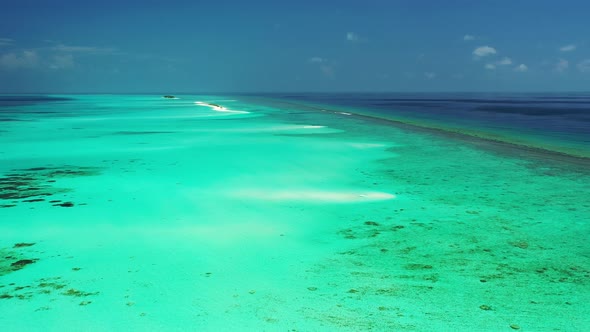 Wide angle drone island view of a paradise sunny white sand beach and turquoise sea background in vi alt