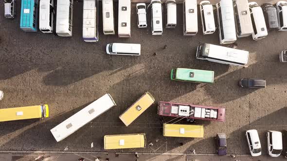 Aerial Footage of Many Cars and Buses Moving on a Busy City Street alt