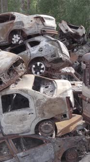 Vertical Video of a Dump of Destroyed Cars During the War in Ukraine alt