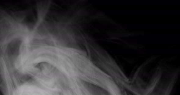 White smoke waving on black background
