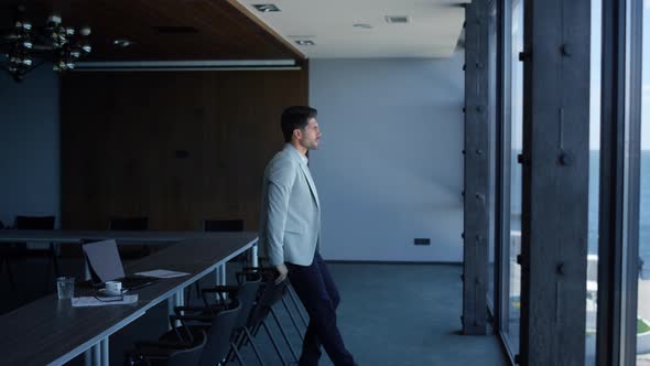 Man Enjoying Break Conference Room alt