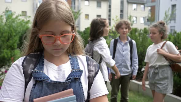 Group of Schoolchildren Scoff at Their Classmate. Child Cruelty. School Bullying. alt
