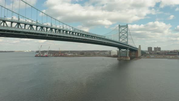 Aerial Drone Shot Ascending Next to Philadelphia's Benjamin Franklin Bridge 