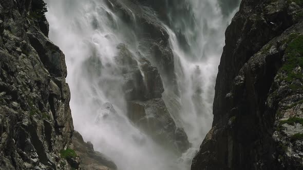 Slow Motion Shot of Waterfall Flowing Down the Rock