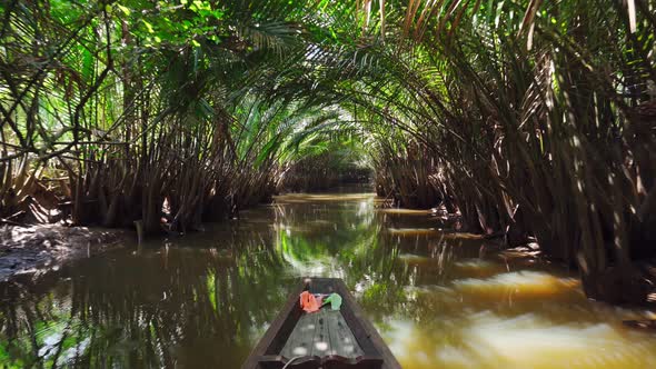 Take a boat trip to see palm tree tunnels and traditional lifestyles at Surat thani, Thailand