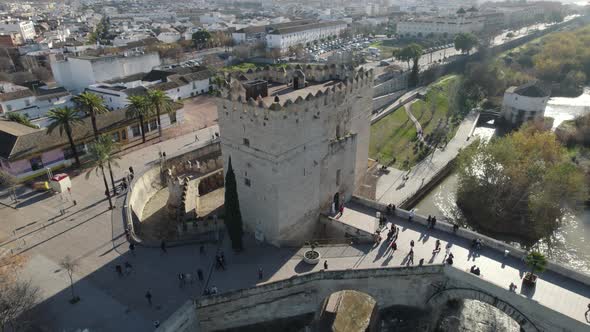 Aerial overhead view of Cordoba Roman bridge and bastion tower, Spain. Aerial circling