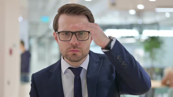 Portrait of Businessman Looking Around Searching alt