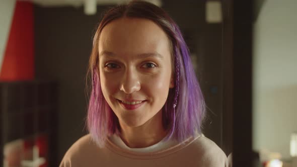 A Young Girlstudent Standing Near the Window Looking at the Camera and Smiling alt